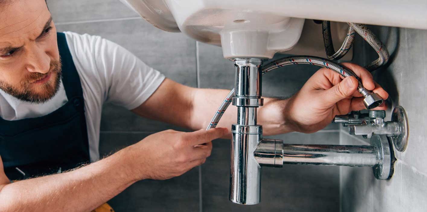 Plumber Attaching Water Pipes